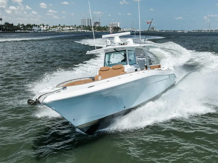 Mo Jack Yacht Photos Pics 2022 HCB Lujo boat cruising on open water under a clear sky.