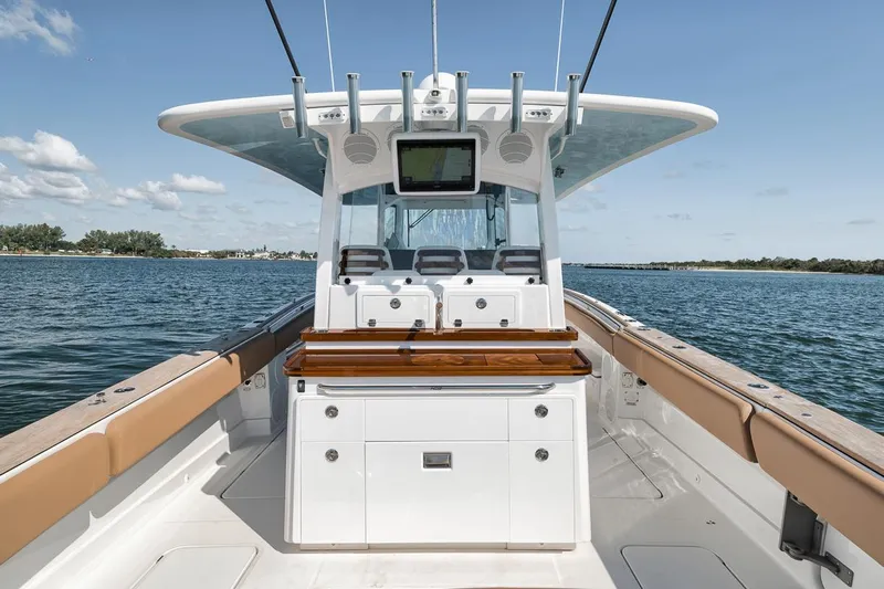 Mo Jack Yacht Photos Pics 2022 HCB Lujo boat interior with helm, seating, and ocean view.