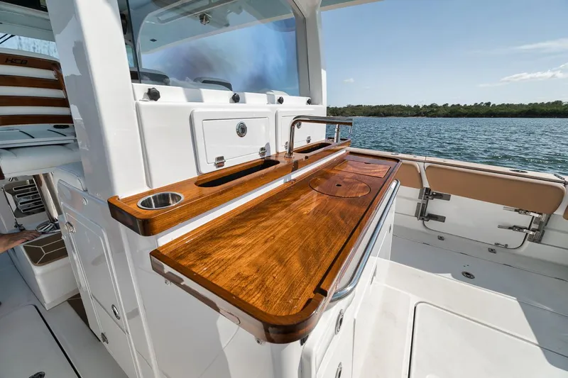 Mo Jack Yacht Photos Pics Luxury 2022 HCB Lujo boat with elegant wooden deck and modern amenities.