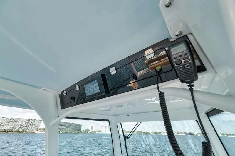 Mo Jack Yacht Photos Pics 2022 HCB Lujo boat interior with control panel and radio on a sunny day.