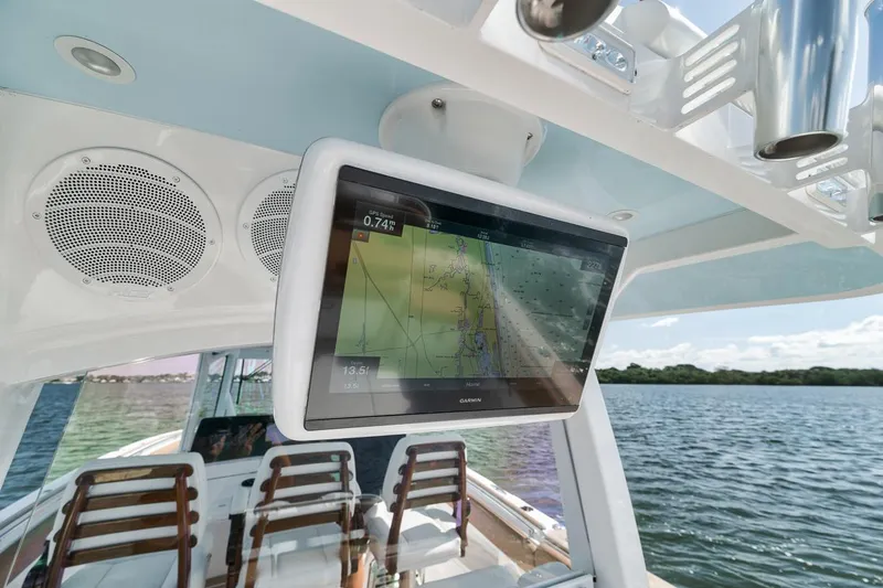 Mo Jack Yacht Photos Pics 2022 HCB Lujo boat with navigation screen and speakers on deck, overlooking water.