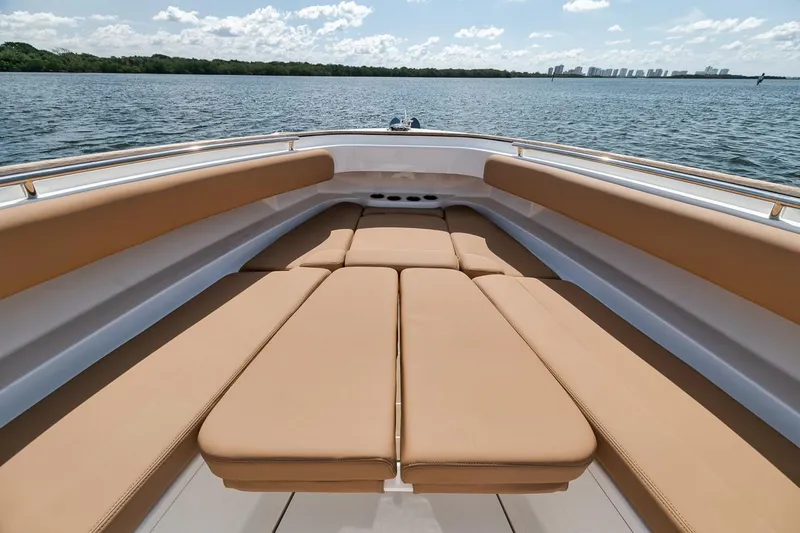 Mo Jack Yacht Photos Pics Luxurious 2022 HCB Lujo boat with spacious tan seating on open water.