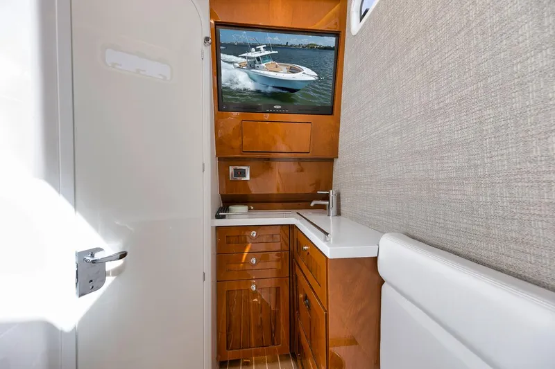 Mo Jack Yacht Photos Pics Luxurious 2022 HCB Lujo yacht interior with sleek wooden cabinetry and modern amenities.