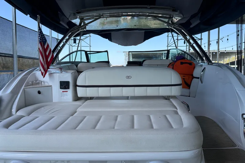  Yacht Photos Pics 2018 Cobalt R35 boat interior with white seating and American flag.