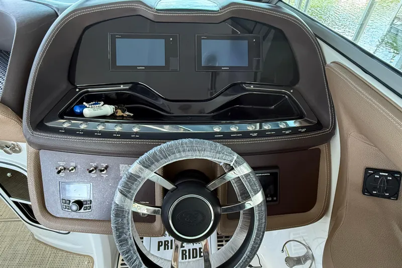  Yacht Photos Pics Cobalt R35 2018 boat dashboard with dual screens and wrapped steering wheel.