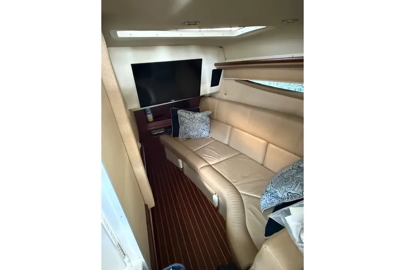  Yacht Photos Pics Luxurious interior of 2018 Cobalt R35 boat with leather seating and TV.