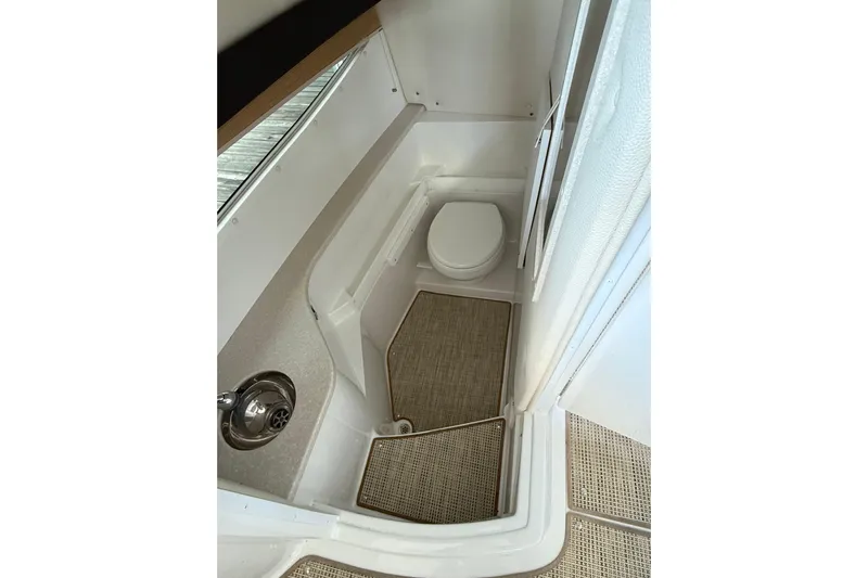  Yacht Photos Pics 2018 Cobalt R35 boat bathroom interior with sink and toilet.
