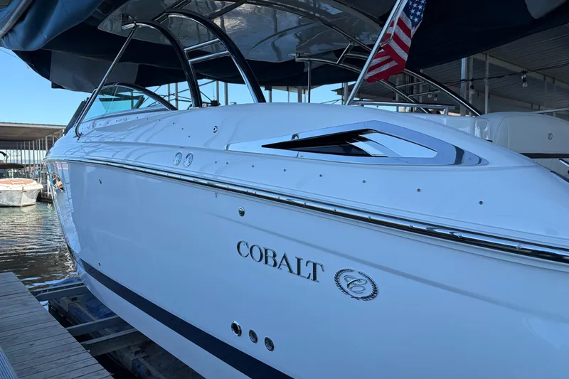  Yacht Photos Pics 2018 Cobalt R35 boat docked, featuring sleek design and American flag.