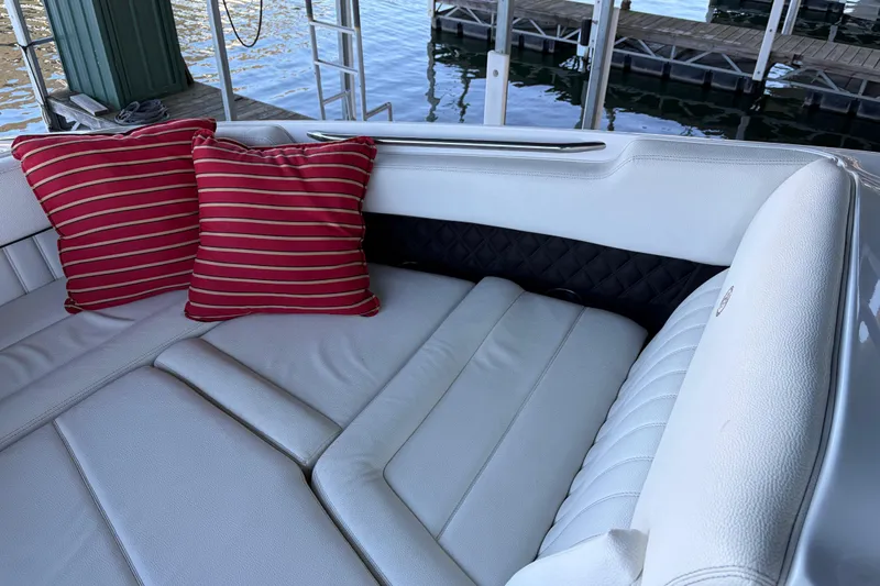  Yacht Photos Pics Luxurious 2018 Cobalt R35 boat interior with white seating and red striped cushions.