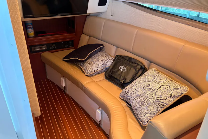  Yacht Photos Pics Luxurious interior of 2018 Cobalt R35 boat with leather seating and decorative pillows.
