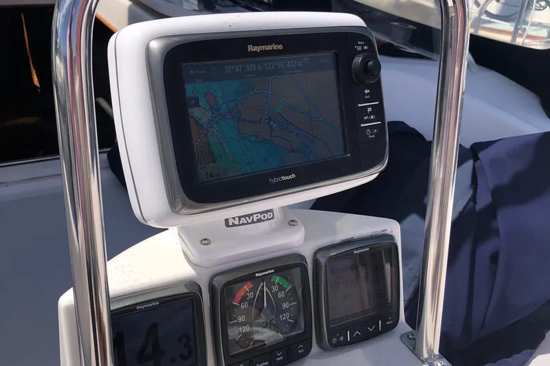 Charmed Life Yacht Photos Pics Navigation equipment on a 2000 Catalina 470 sailboat, featuring Raymarine displays.