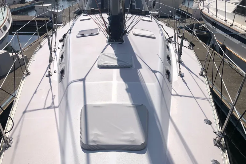 Charmed Life Yacht Photos Pics 2000 Catalina 470 sailboat deck view, docked at marina, showcasing sleek design and rigging.