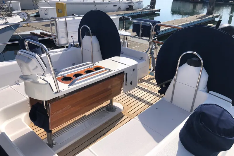 Charmed Life Yacht Photos Pics Cockpit of a 2000 Catalina 470 sailboat with dual steering wheels and wooden accents.