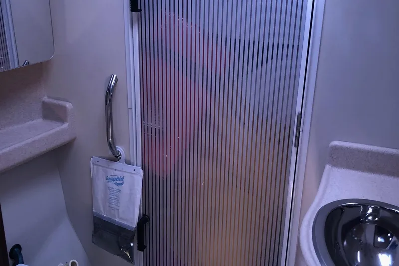 Charmed Life Yacht Photos Pics Bathroom interior of 2000 Catalina 470 yacht with shower and sink.