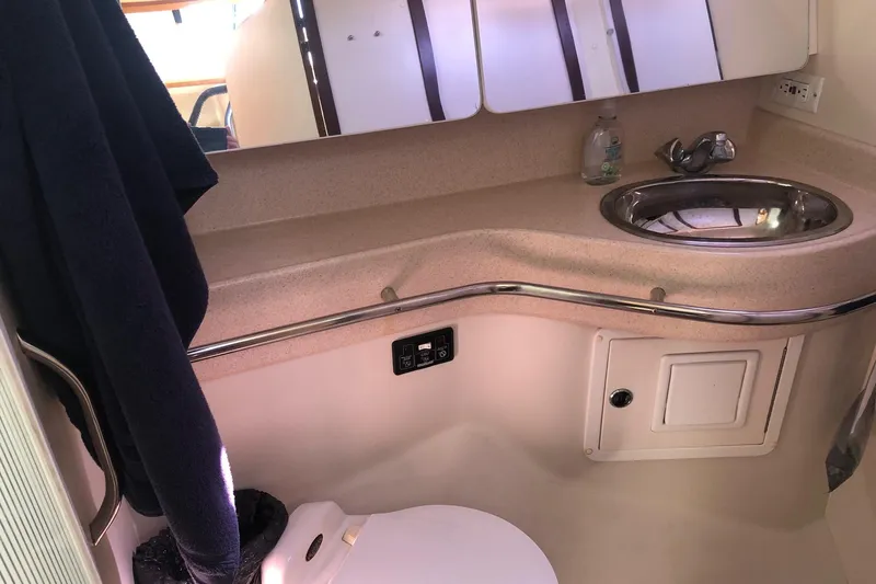 Charmed Life Yacht Photos Pics Bathroom interior of 2000 Catalina 470 yacht with sink and mirror.