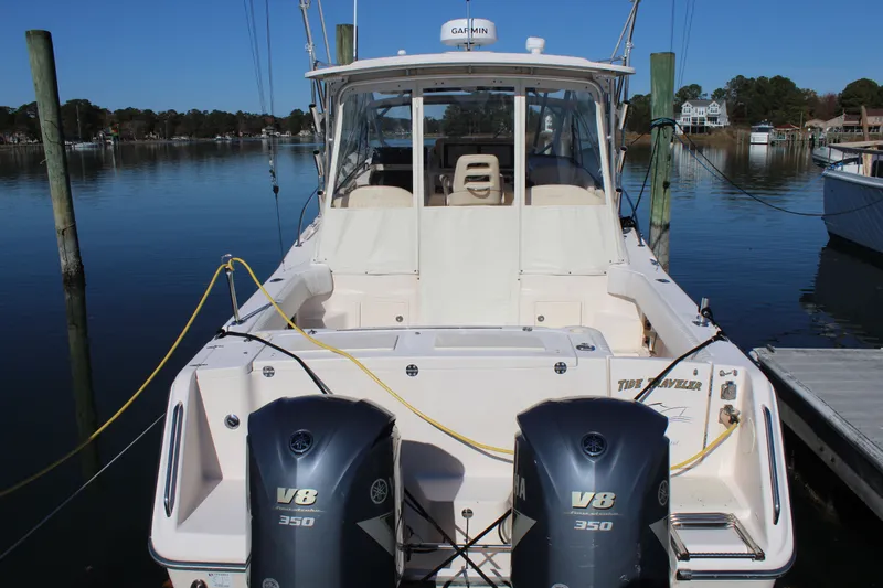 Tide Traveler Yacht Photos Pics 2008 Grady-White Express 330 boat docked with twin Yamaha V8 engines.