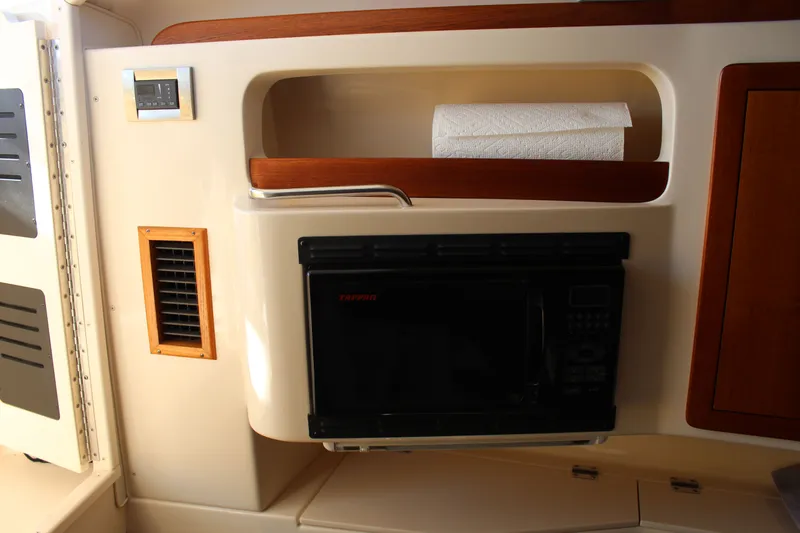 Tide Traveler Yacht Photos Pics 2008 Grady-White Express 330 interior with microwave and paper towel holder.