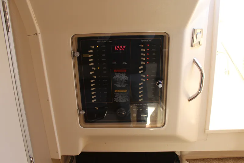 Tide Traveler Yacht Photos Pics Electrical panel on a 2008 Grady-White Express 330 boat, showing voltage and switches.