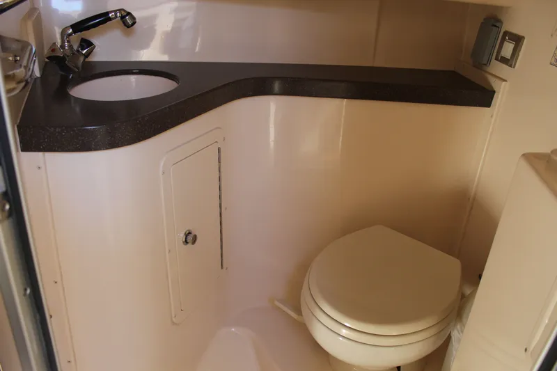 Tide Traveler Yacht Photos Pics 2008 Grady-White Express 330 boat bathroom with sink and toilet.