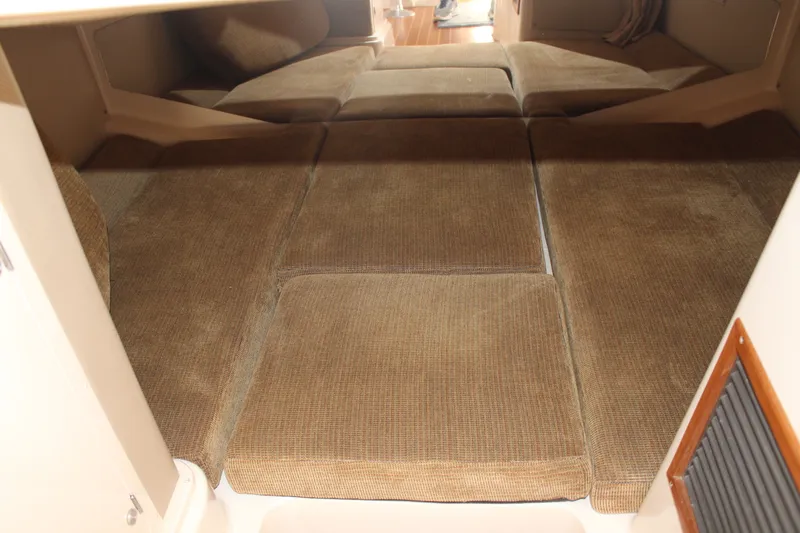 Tide Traveler Yacht Photos Pics Interior cabin of 2008 Grady-White Express 330 with cushioned sleeping area.