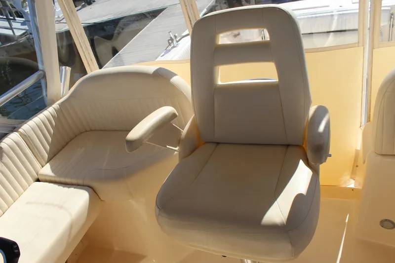 Tide Traveler Yacht Photos Pics Luxurious seating on 2008 Grady-White Express 330 boat, featuring plush beige upholstery.