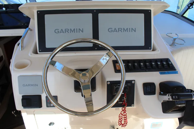 Tide Traveler Yacht Photos Pics Helm of 2008 Grady-White Express 330 with Garmin navigation displays and controls.