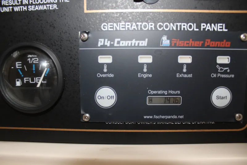 Tide Traveler Yacht Photos Pics 2008 Grady-White Express 330 generator control panel with fuel gauge and operating hours display.