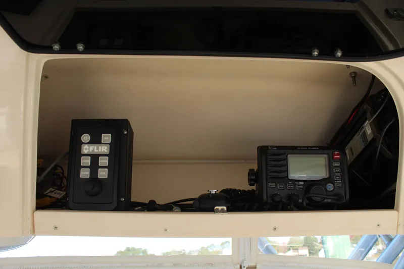 Tide Traveler Yacht Photos Pics 2008 Grady-White Express 330 electronics compartment with FLIR and Icom devices.