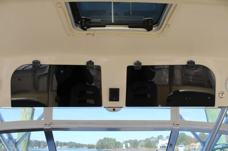 Tide Traveler Yacht Photos Pics 2008 Grady-White Express 330 boat interior with overhead storage and hatch.