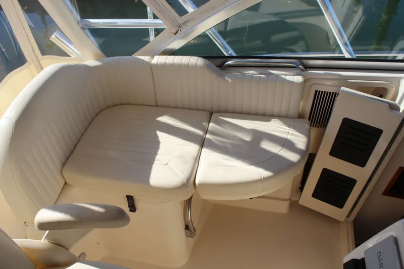 Tide Traveler Yacht Photos Pics 2008 Grady-White Express 330 boat interior with white cushioned seating.