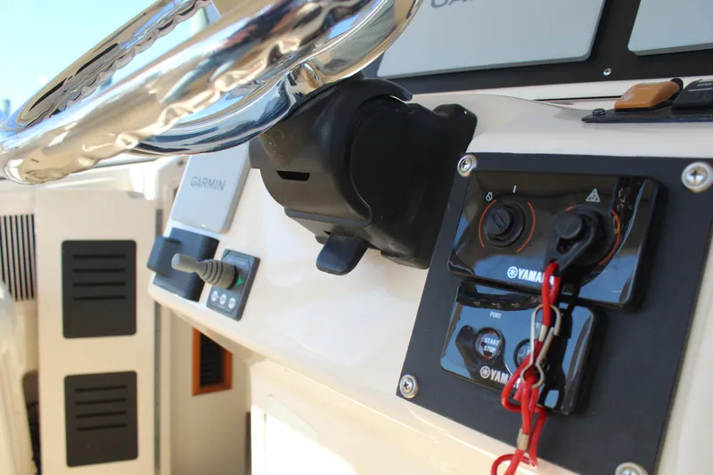 Tide Traveler Yacht Photos Pics Close-up of 2008 Grady-White Express 330 boat controls and steering wheel.