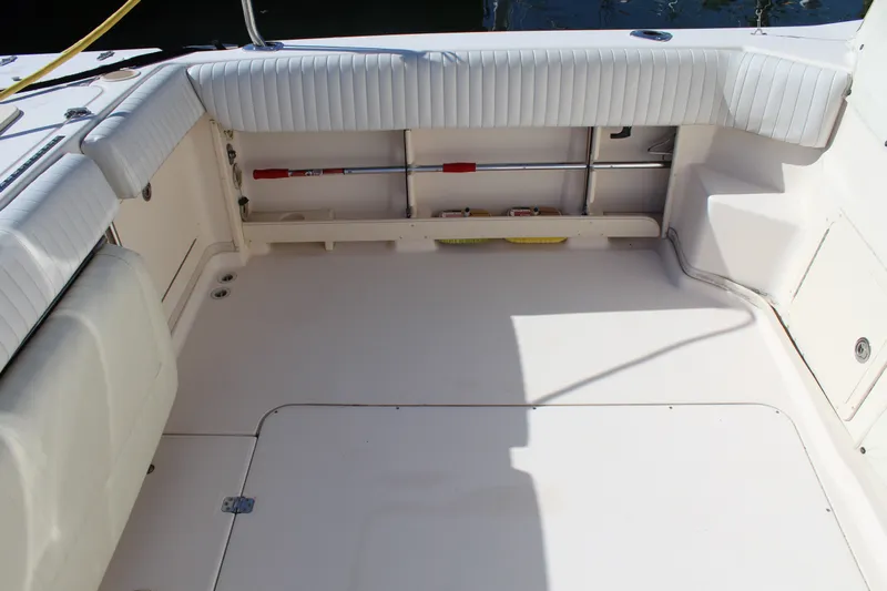 Tide Traveler Yacht Photos Pics 2008 Grady-White Express 330 boat interior with cushioned seating and storage compartments.