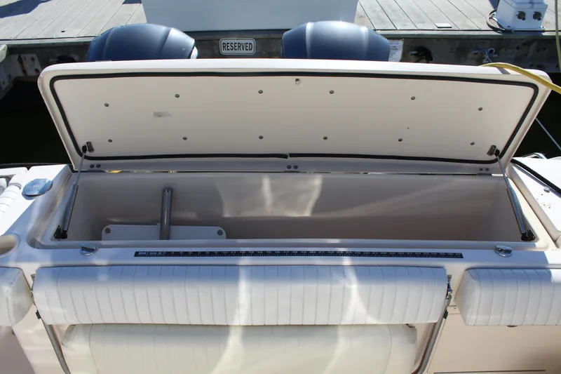 Tide Traveler Yacht Photos Pics Open storage compartment on a 2008 Grady-White Express 330 boat, docked at a marina.