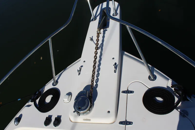 Tide Traveler Yacht Photos Pics Bow of 2008 Grady-White Express 330 with anchor chain and railings.