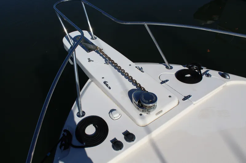 Tide Traveler Yacht Photos Pics Bow of 2008 Grady-White Express 330 with anchor chain and railing.