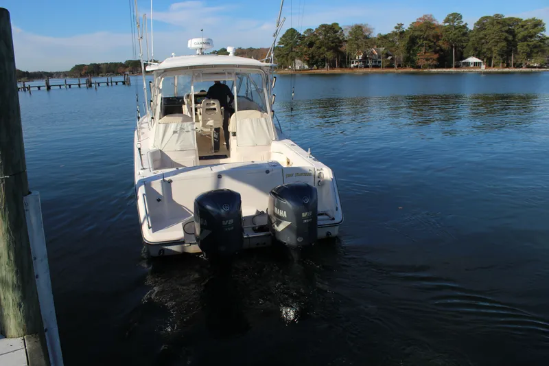 Tide Traveler Yacht Photos Pics 2008 Grady-White Express 330 boat with twin Yamaha engines on calm water.