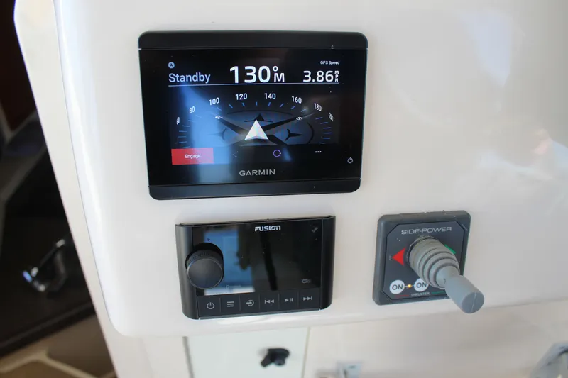 Tide Traveler Yacht Photos Pics Control panel of a 2008 Grady-White Express 330 with Garmin and Fusion systems.