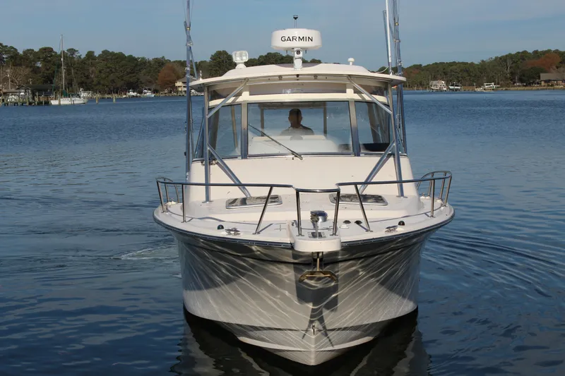 Tide Traveler Yacht Photos Pics 2008 Grady-White Express 330 boat on calm water, front view with Garmin equipment.