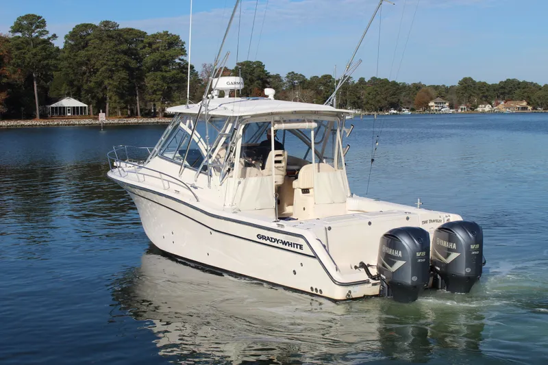 Tide Traveler Yacht Photos Pics 2008 Grady-White Express 330 boat with twin Yamaha engines on a serene lake.