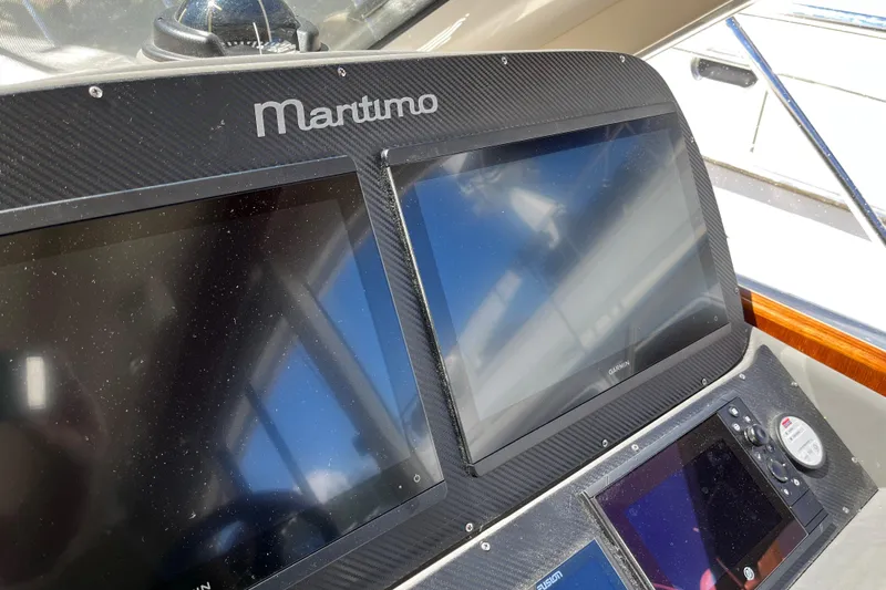 Dolce Far Niente Yacht Photos Pics Dashboard of 2012 Maritimo C53 Sports Cabriolet with navigation screens.