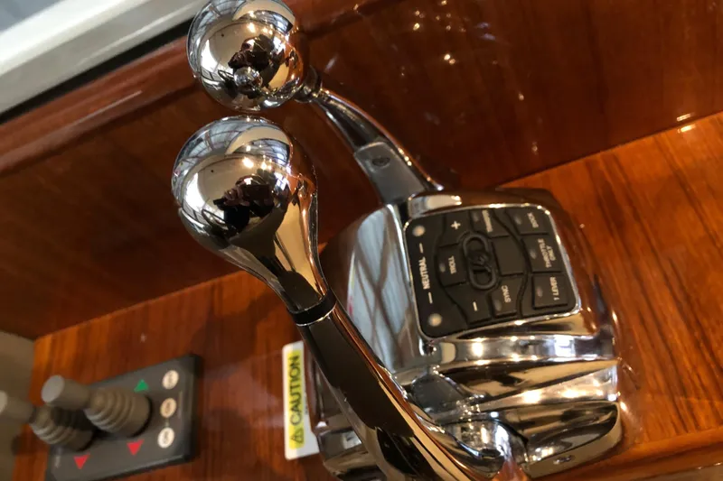 Dolce Far Niente Yacht Photos Pics Chrome throttle controls on 2012 Maritimo C53 Sports Cabriolet yacht dashboard.