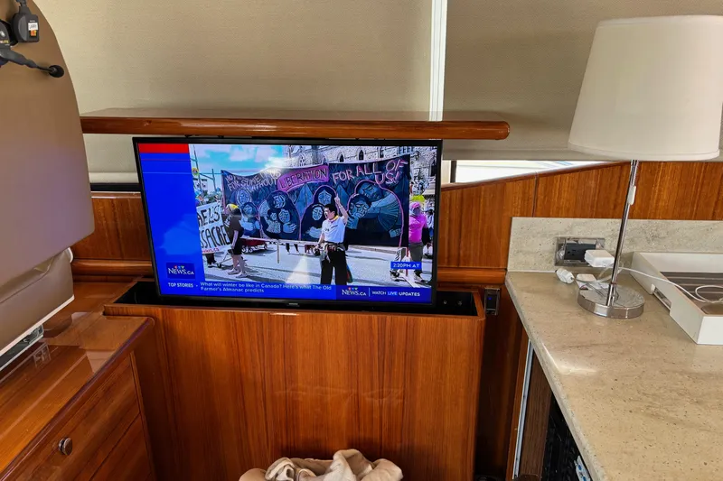 Dolce Far Niente Yacht Photos Pics Interior of 2012 Maritimo C53 Sports Cabriolet with TV and lamp.