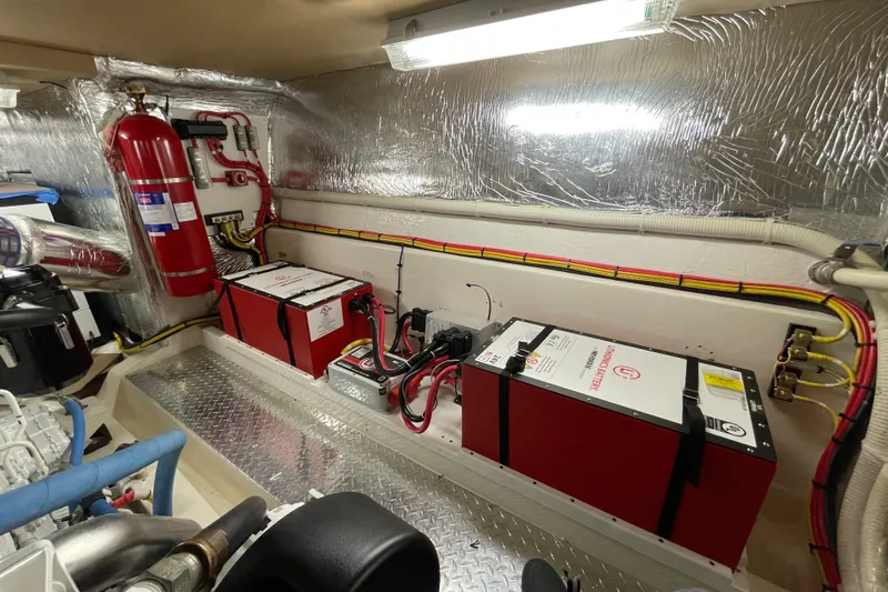 Dolce Far Niente Yacht Photos Pics Engine room of 2012 Maritimo C53 Sports Cabriolet with batteries and fire extinguisher.