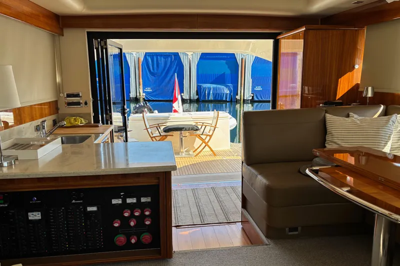 Dolce Far Niente Yacht Photos Pics Interior of 2012 Maritimo C53 Sports Cabriolet yacht with modern furnishings and outdoor view.