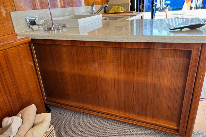 Dolce Far Niente Yacht Photos Pics 2012 Maritimo C53 Sports Cabriolet interior with wooden cabinetry and countertop.