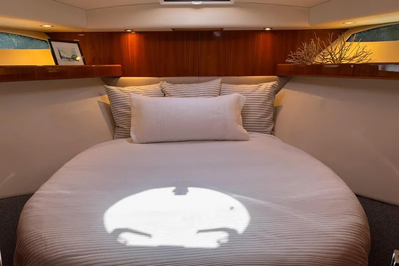 Dolce Far Niente Yacht Photos Pics Luxurious cabin interior of 2012 Maritimo C53 Sports Cabriolet yacht with cozy bedding.