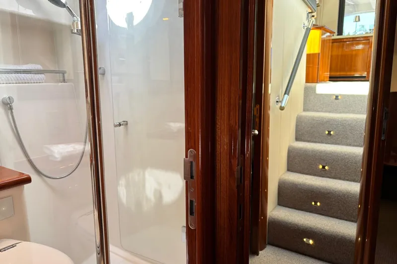 Dolce Far Niente Yacht Photos Pics Interior of 2012 Maritimo C53 Sports Cabriolet showing bathroom and carpeted stairs.