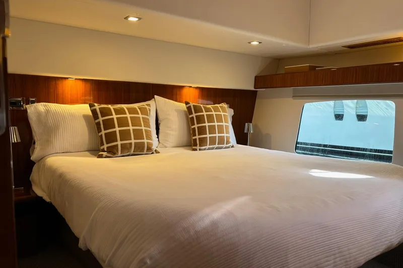 Dolce Far Niente Yacht Photos Pics Luxurious bedroom interior of 2012 Maritimo C53 Sports Cabriolet yacht with elegant bedding.