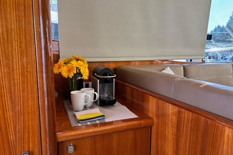 Dolce Far Niente Yacht Photos Pics Interior of 2012 Maritimo C53 Sports Cabriolet with flowers and coffee setup.