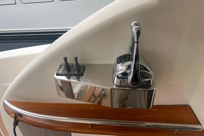 Dolce Far Niente Yacht Photos Pics Control panel of a 2012 Maritimo C53 Sports Cabriolet yacht, featuring sleek chrome levers.